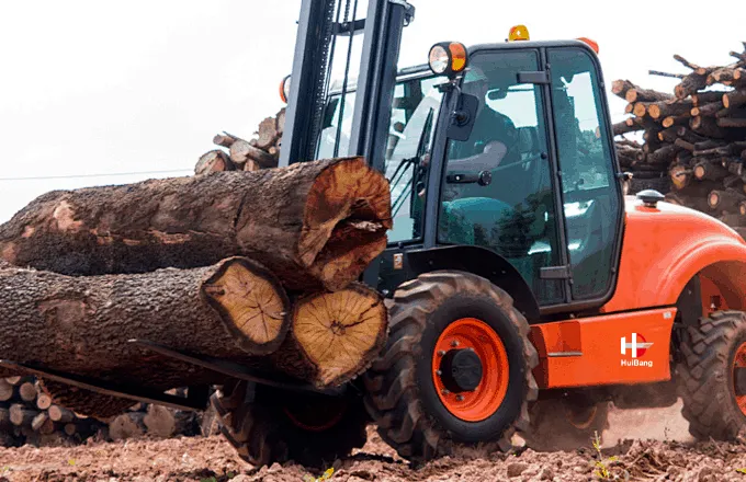 rough terrain forklift carrying lumber